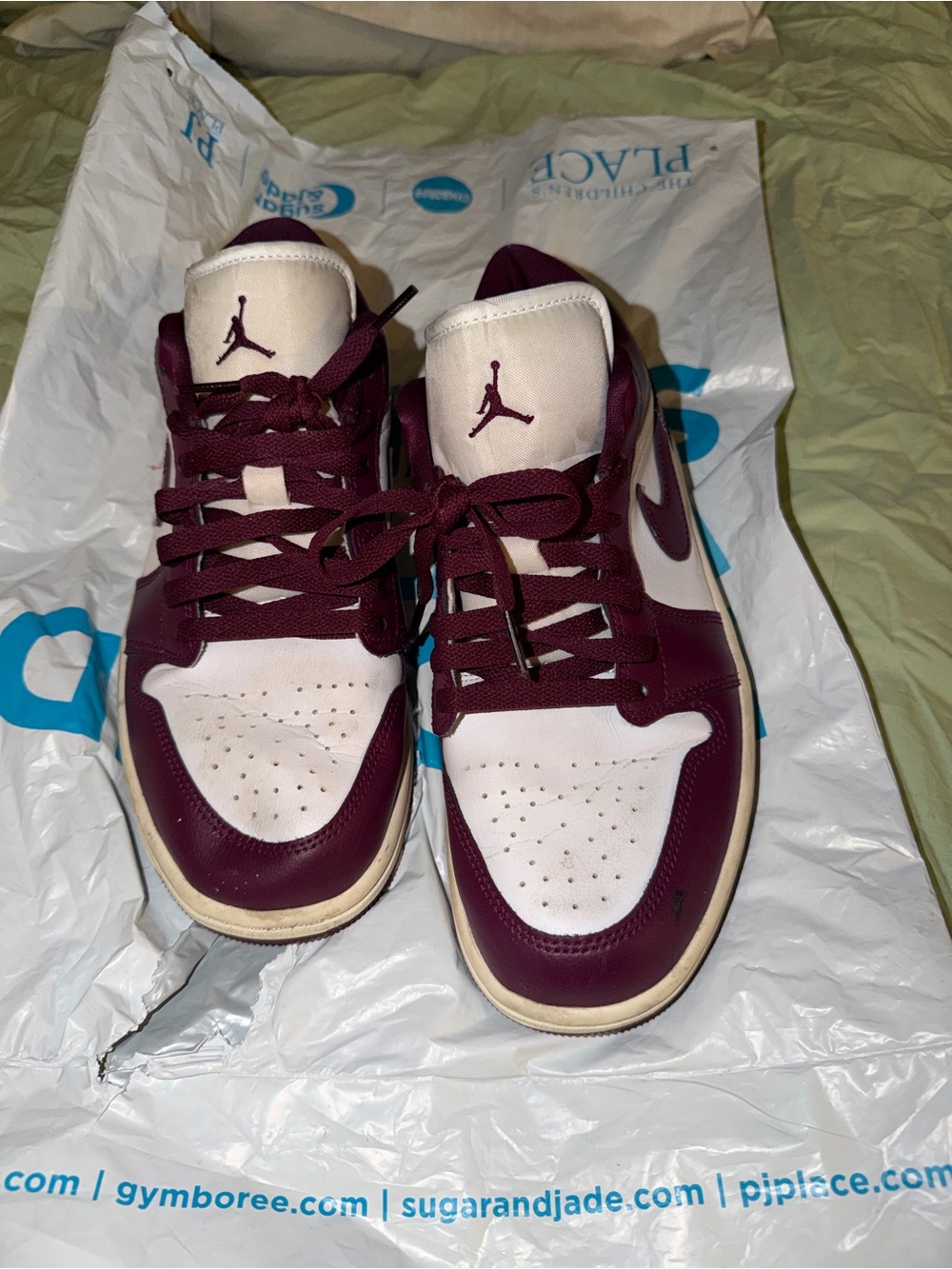 Jordan 1 low womenโs ' White and Maroon High-Top Sneakers